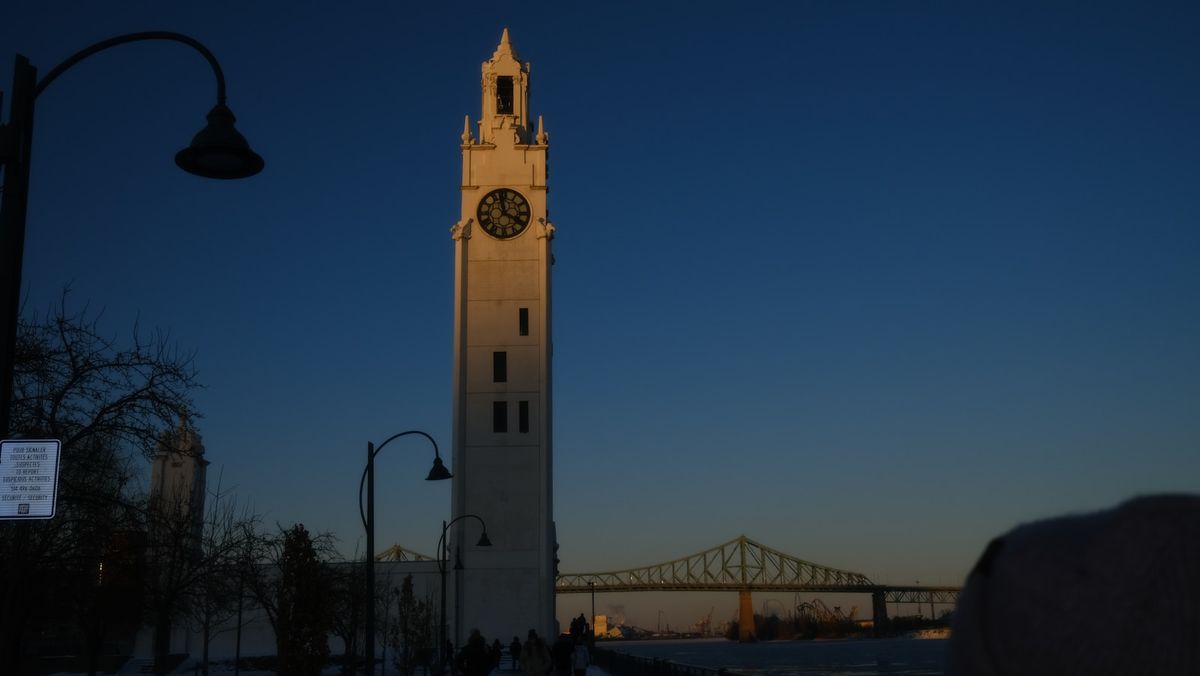Montreal clock tower and bridge at dusk