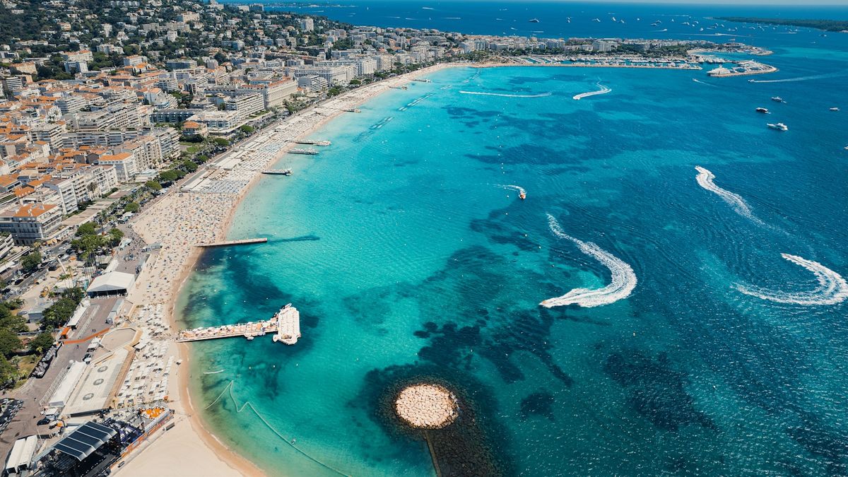 Aerial view of Cannes beach with boats along the French Riviera