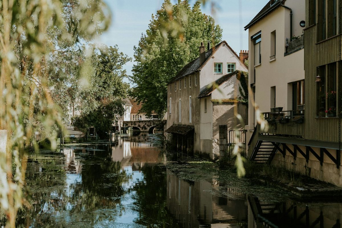 River through Chartres old town with cathedral, France