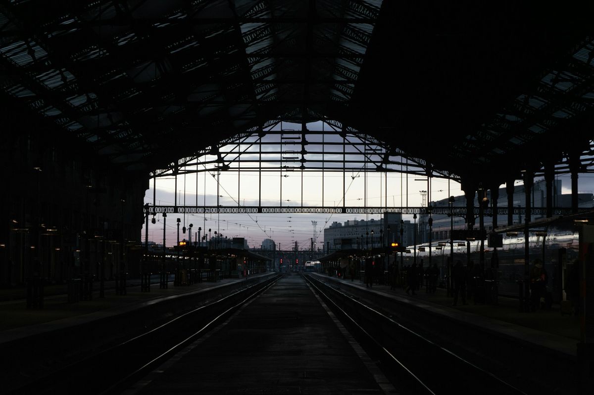 Paris Gare de Lyon interior with glass ceiling and tracks