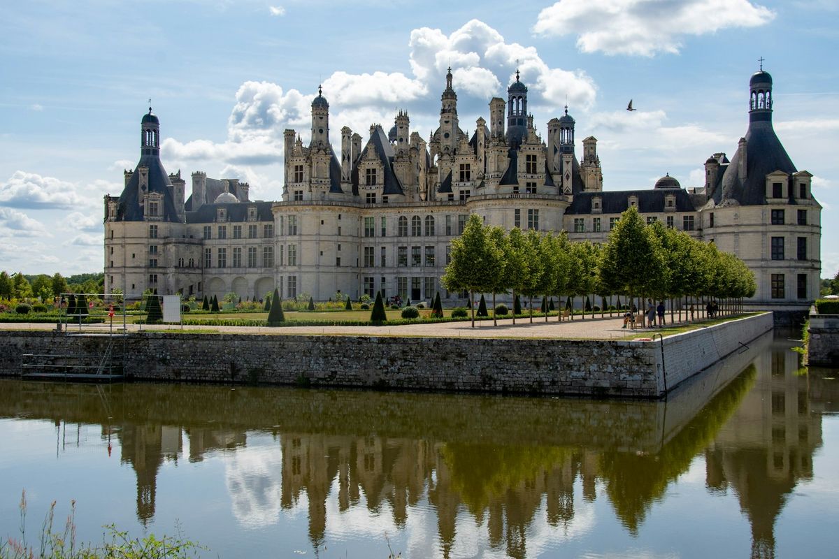 Chateau de Chambord reflected in the water, Loire Valley