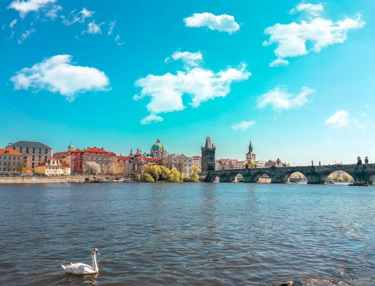 Bridge leading to Prague old town with castle and river