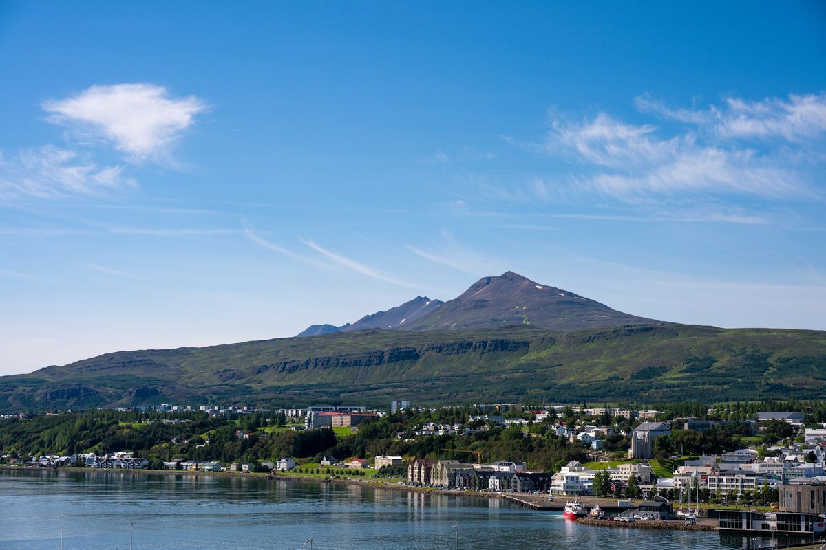 Coastal town Akureyri with mountain backdrop Iceland