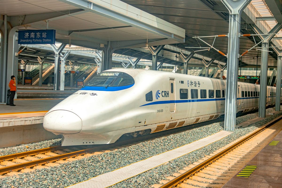 Chinese Fuxing high-speed bullet train arriving at a station