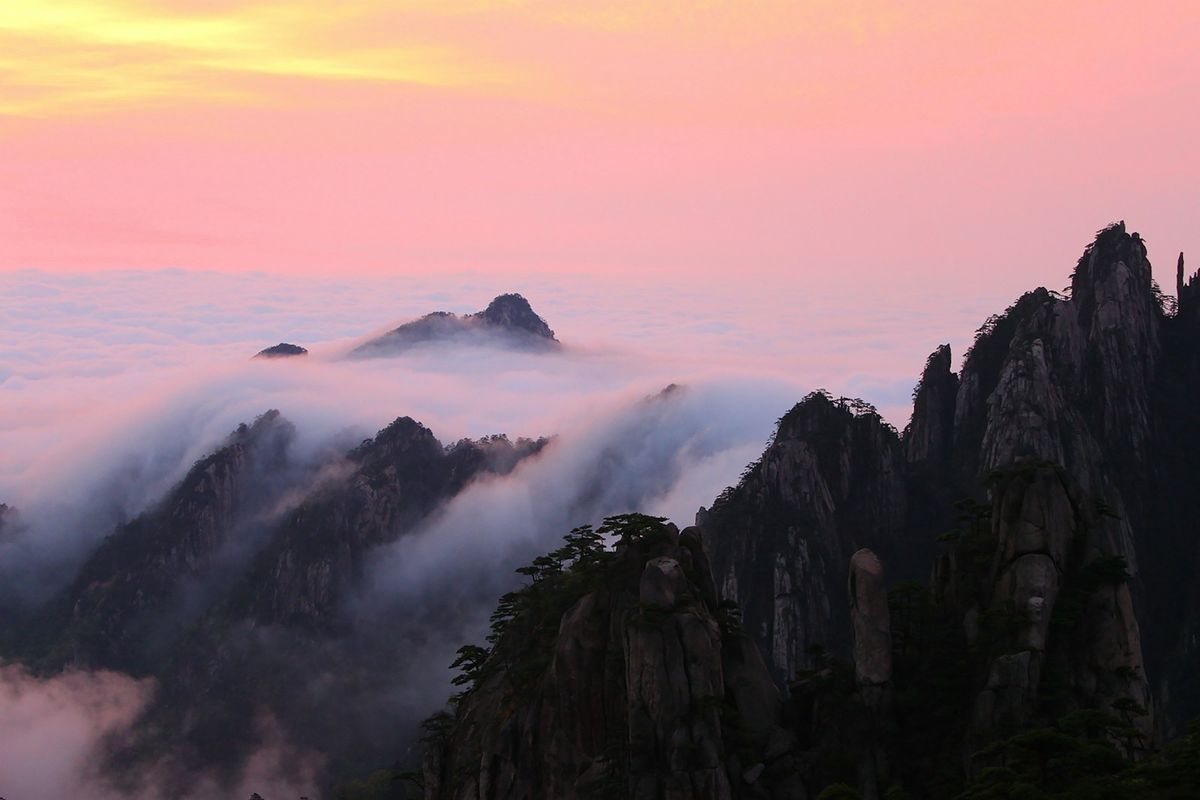 Yellow Mountains peaks rising above a sea of clouds, Huangshan