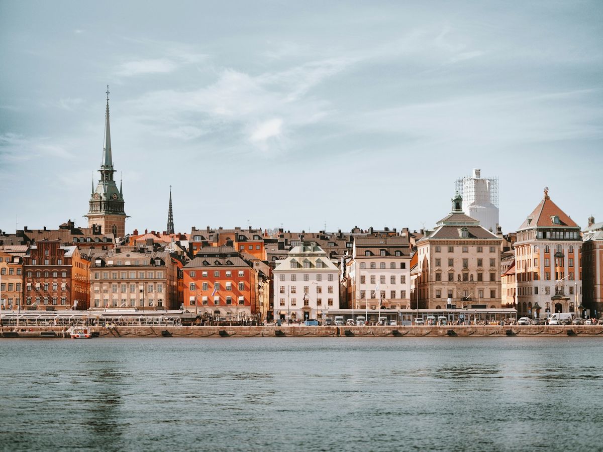Stockholm waterfront with historic buildings reflected in calm water