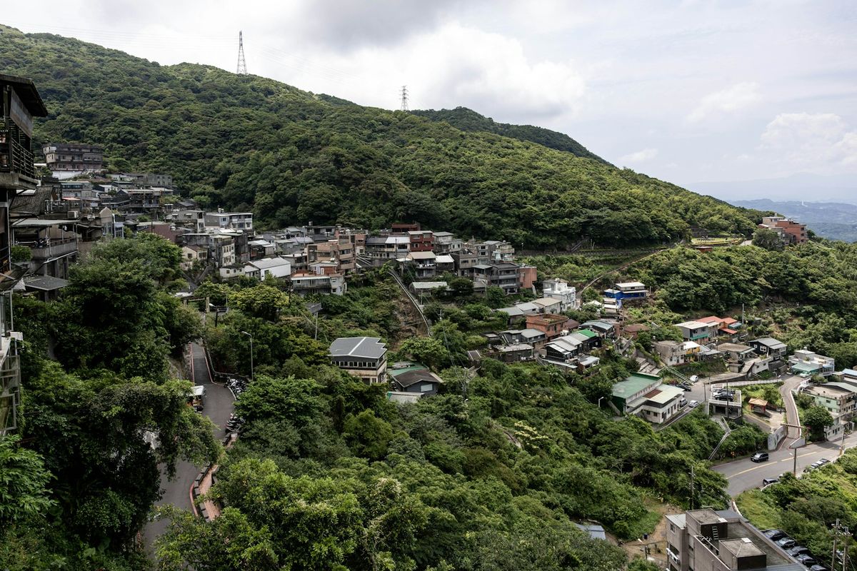 Hillside village of Jiufen nestled among lush green mountains Taiwan