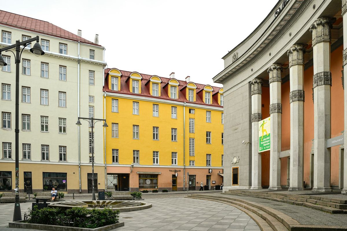 Tartu town hall square with classical columns and colourful buildings