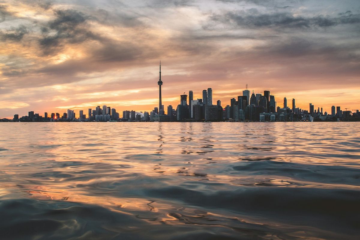 Toronto skyline across Lake Ontario on a cloudy day