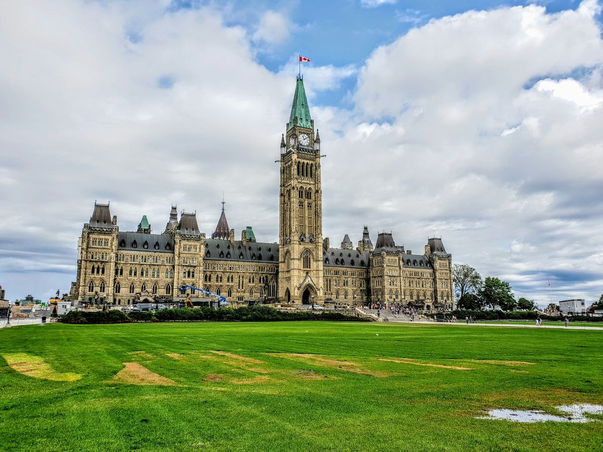 Ottawa Parliament Hill building under cloudy sky