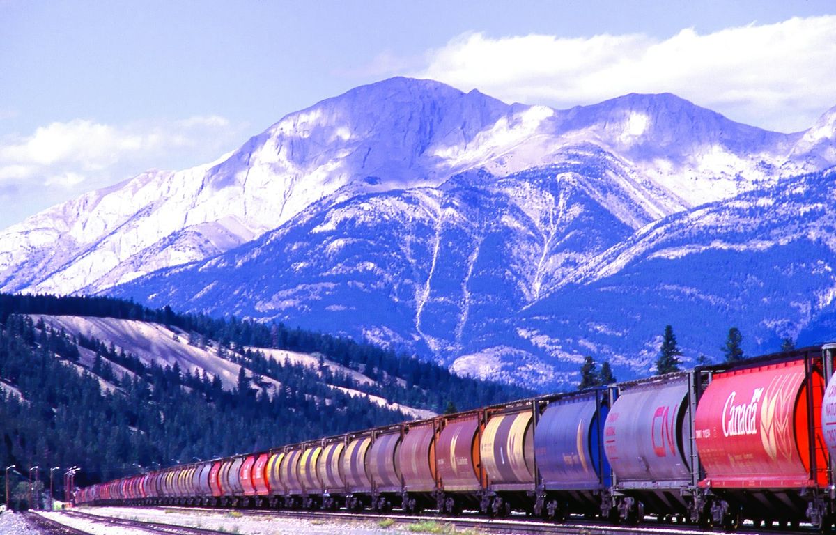 Transcontinental train winding through the Canadian Rockies