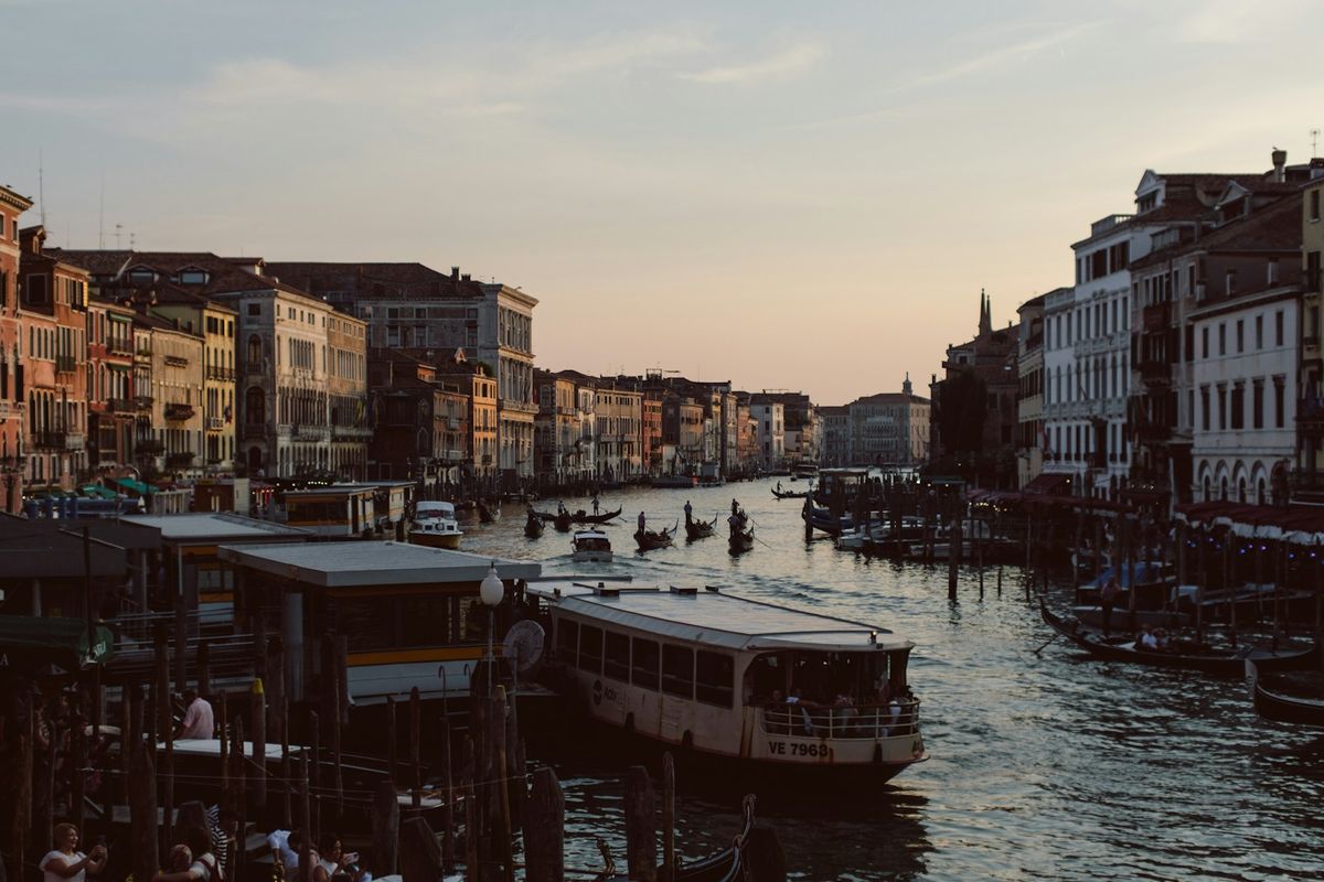 Venice canal with boats and historic buildings