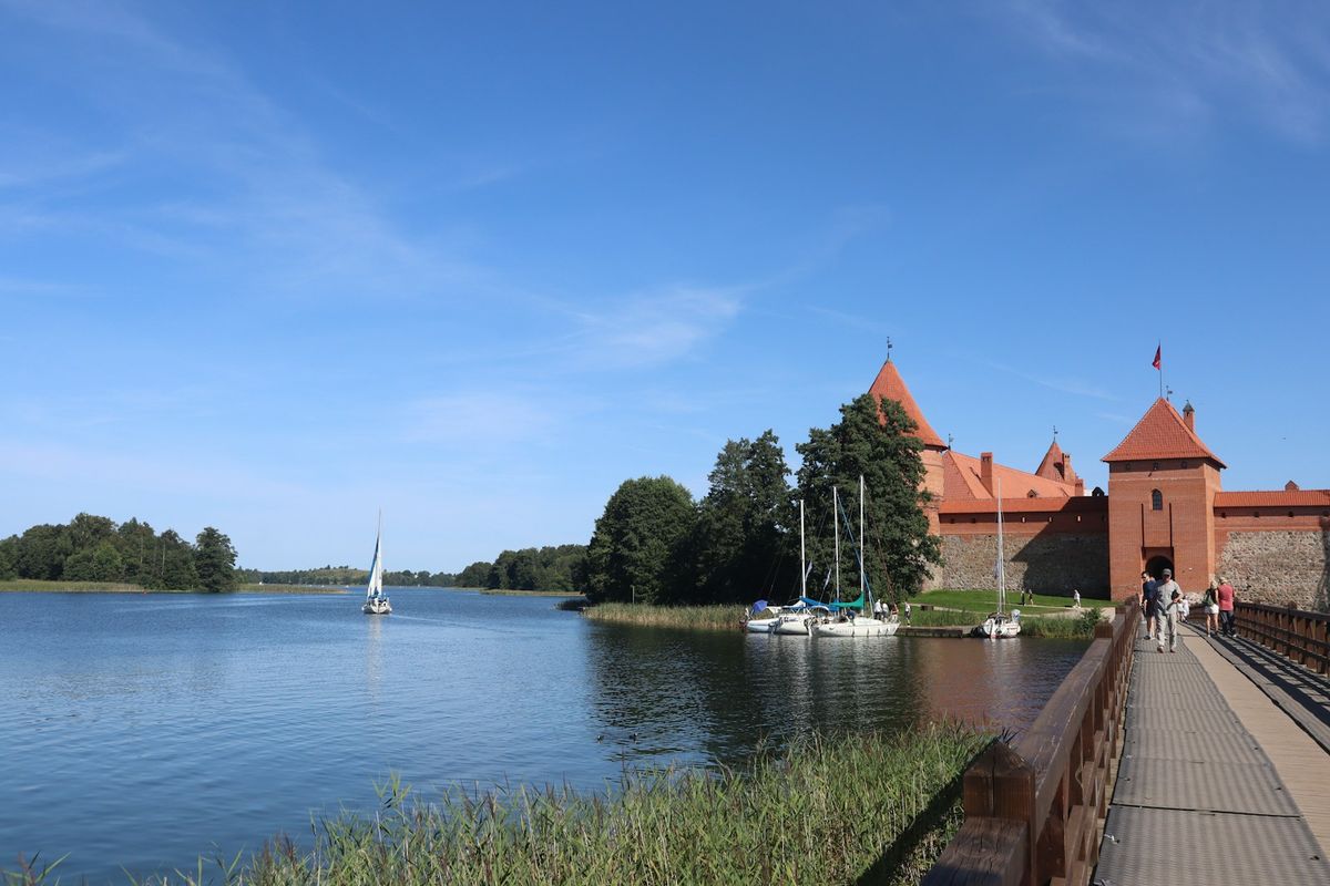 Trakai Castle with a bridge and sailboats on the lake, Lithuania
