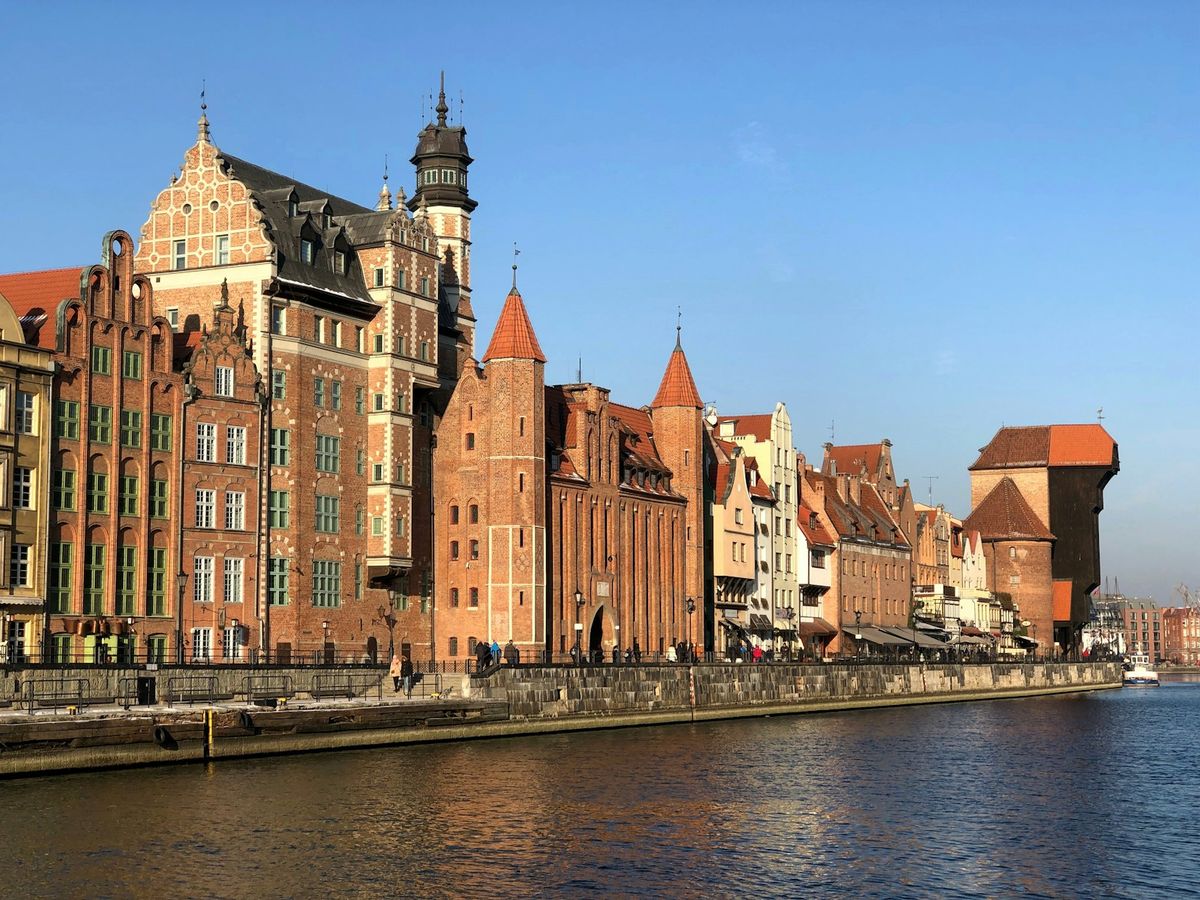 Historic waterfront buildings and crane along the Motlawa river in Gdansk, Poland