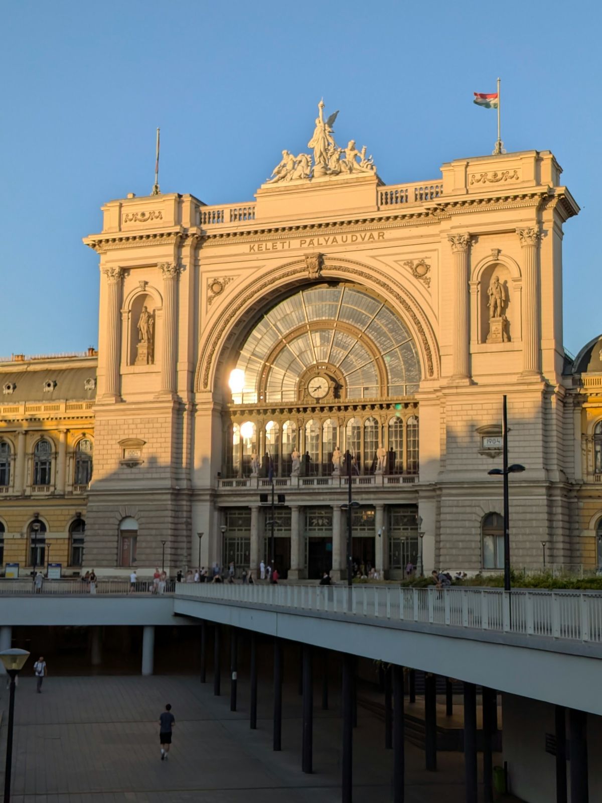 Grand European train station facade in golden hour light