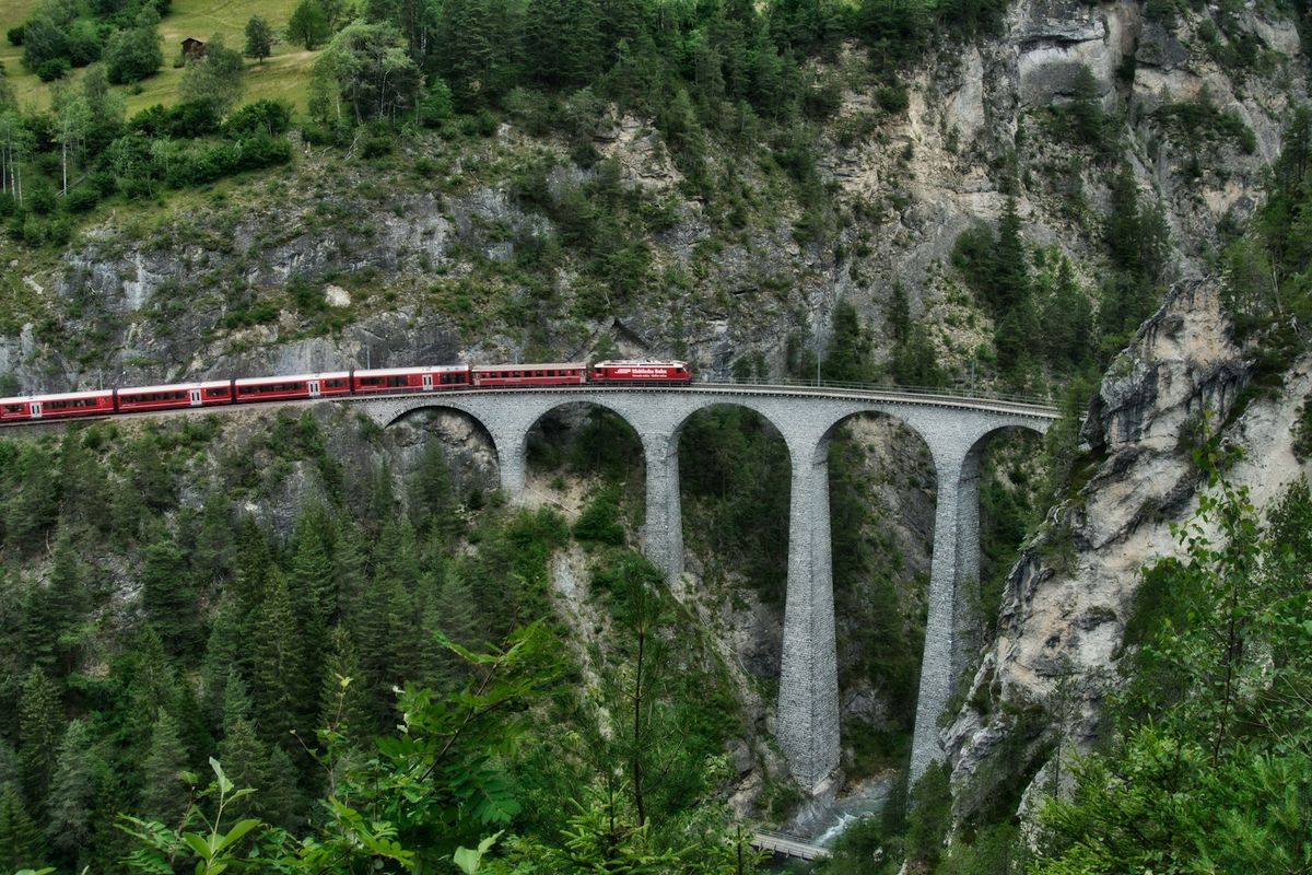 Red alpine train in the Swiss mountains