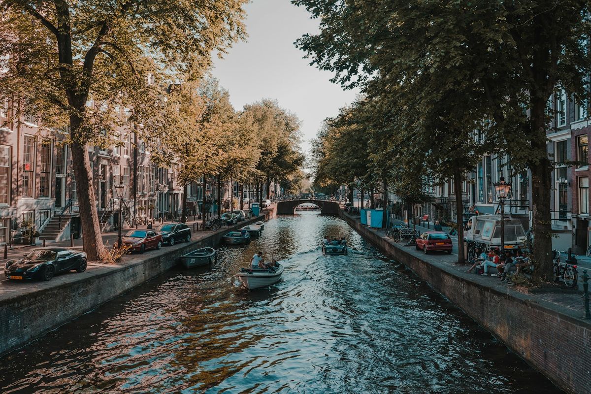 Amsterdam canal with traditional Dutch houses during daytime