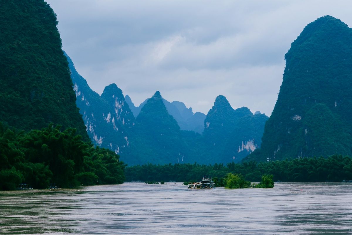 Boat on Li River with karst mountains in Guilin, China