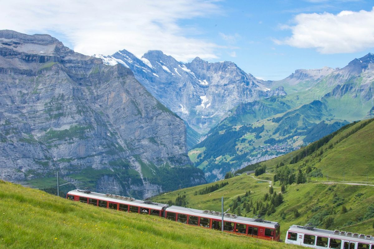 Red and white scenic train in the European Alps