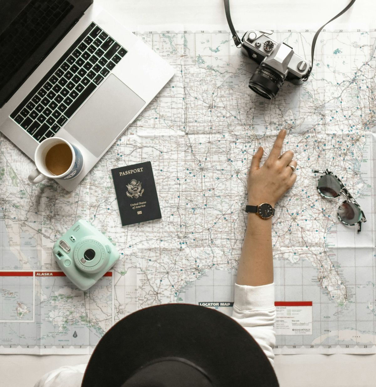 Traveler pointing at a map while planning a trip