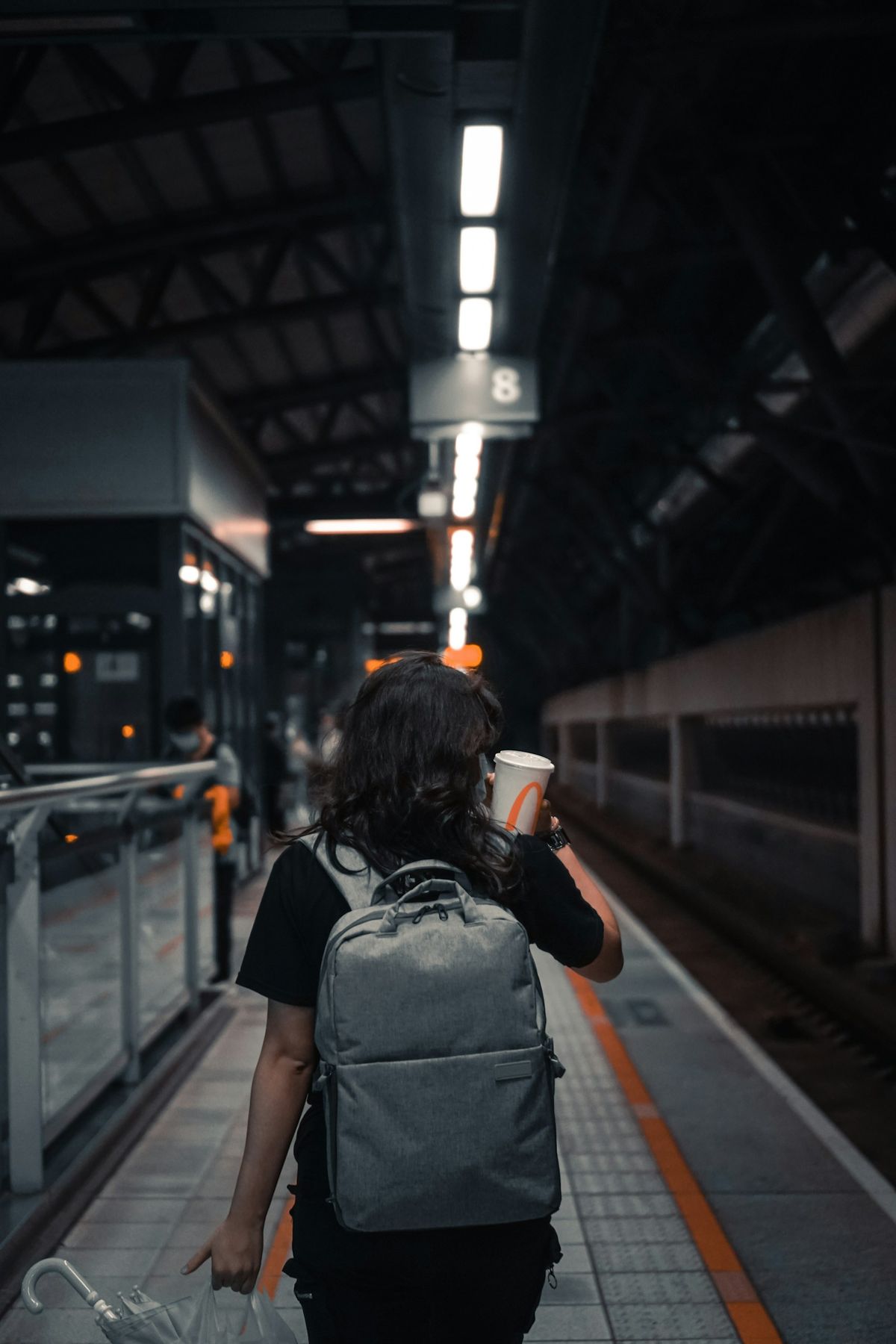 Backpacker with luggage at a European railway station