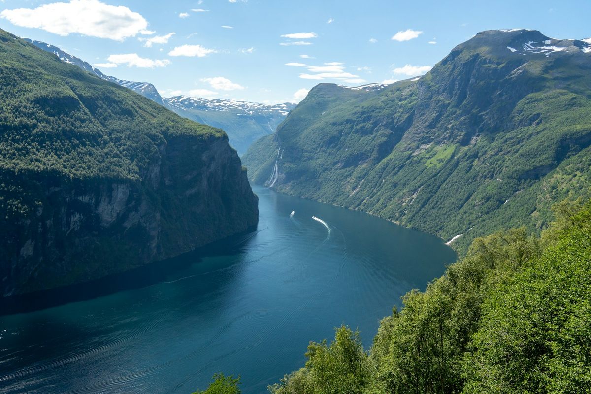 Scenic Norwegian fjord valley river surrounded by mountains