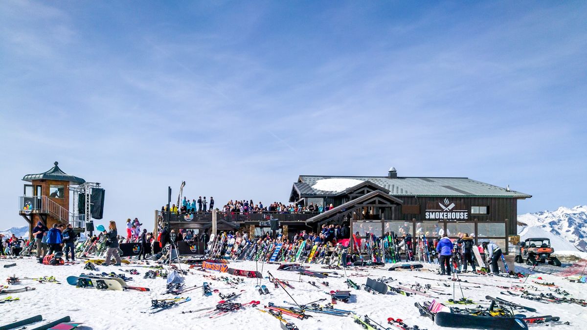 Ski resort with skiers and equipment in the snowy Alps
