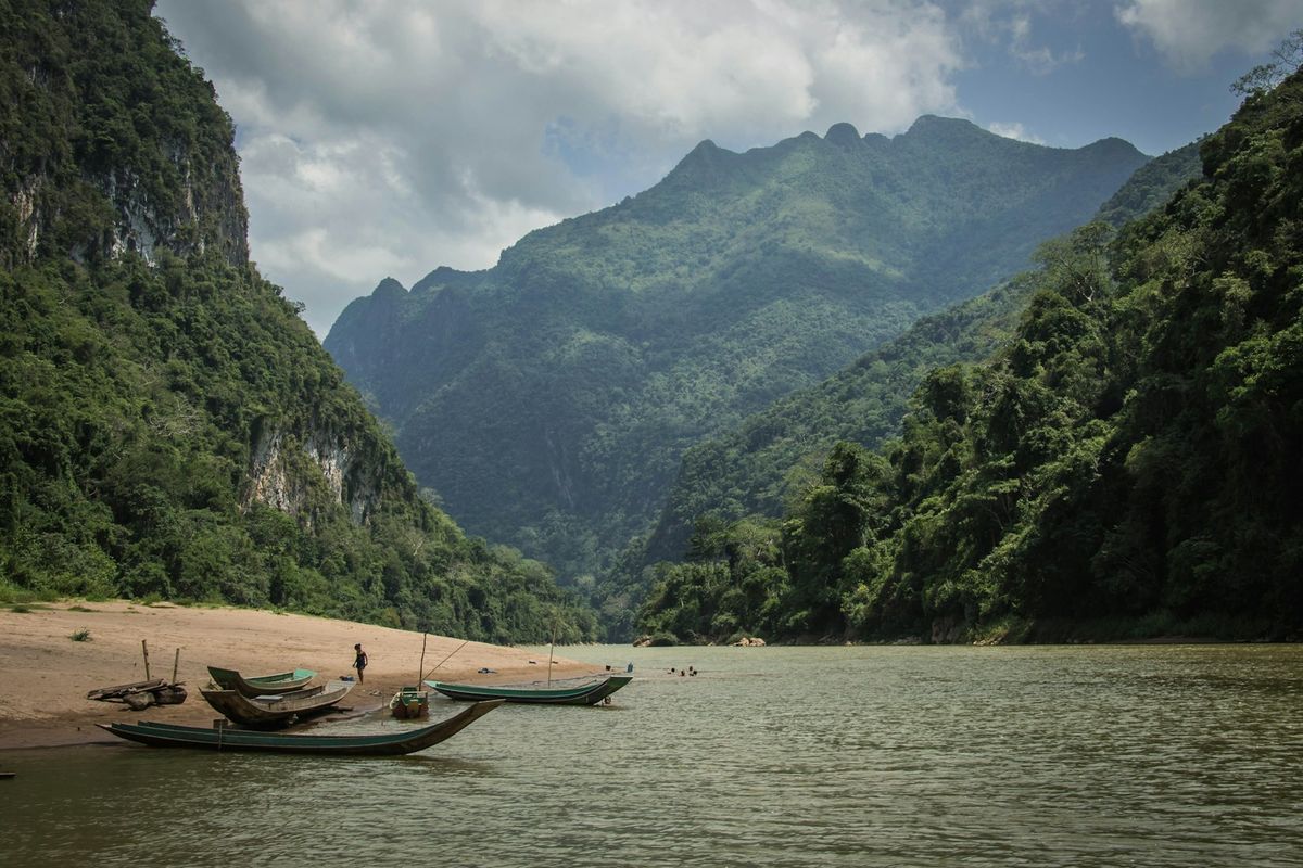 Wooden slow boats moored on the Mekong River