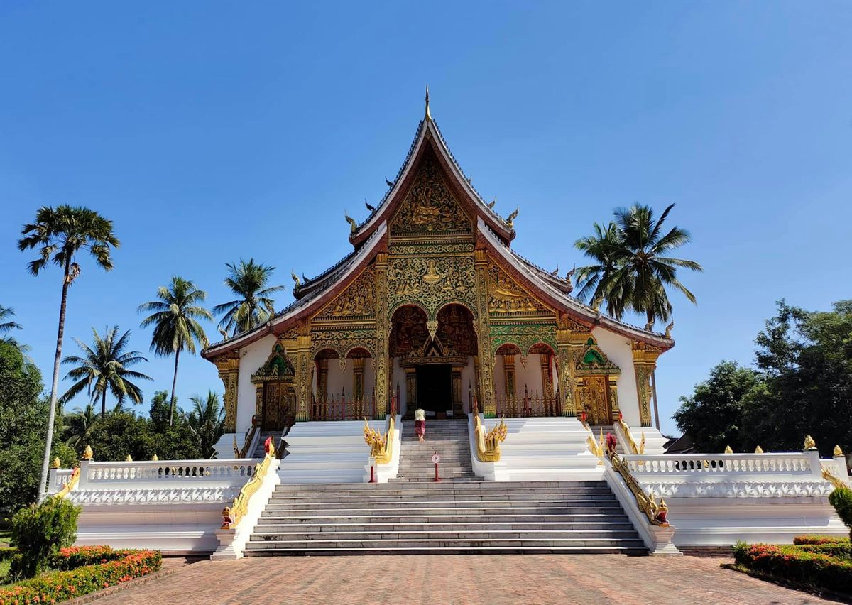 Temple building in Luang Prabang, Laos, under a clear blue sky