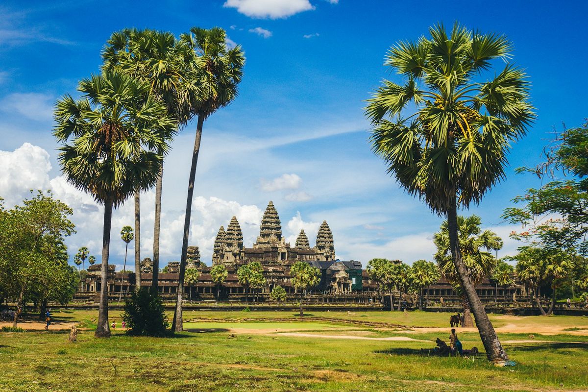 Ancient Angkor Wat temple in Cambodia under blue sky