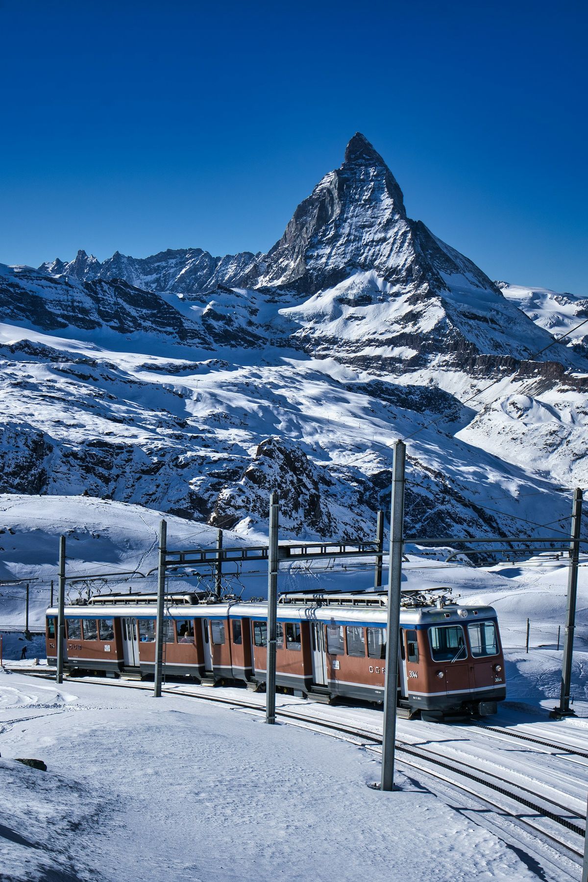 A train through the snowy Swiss Alps