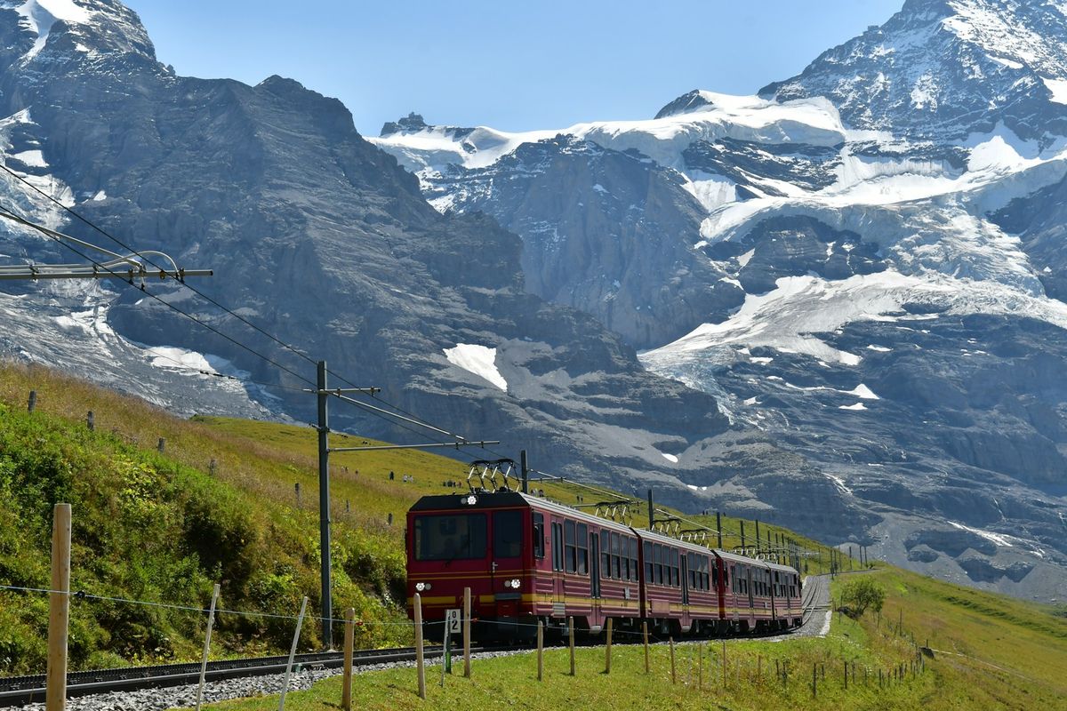 Train travelling through snowy mountains in Europe
