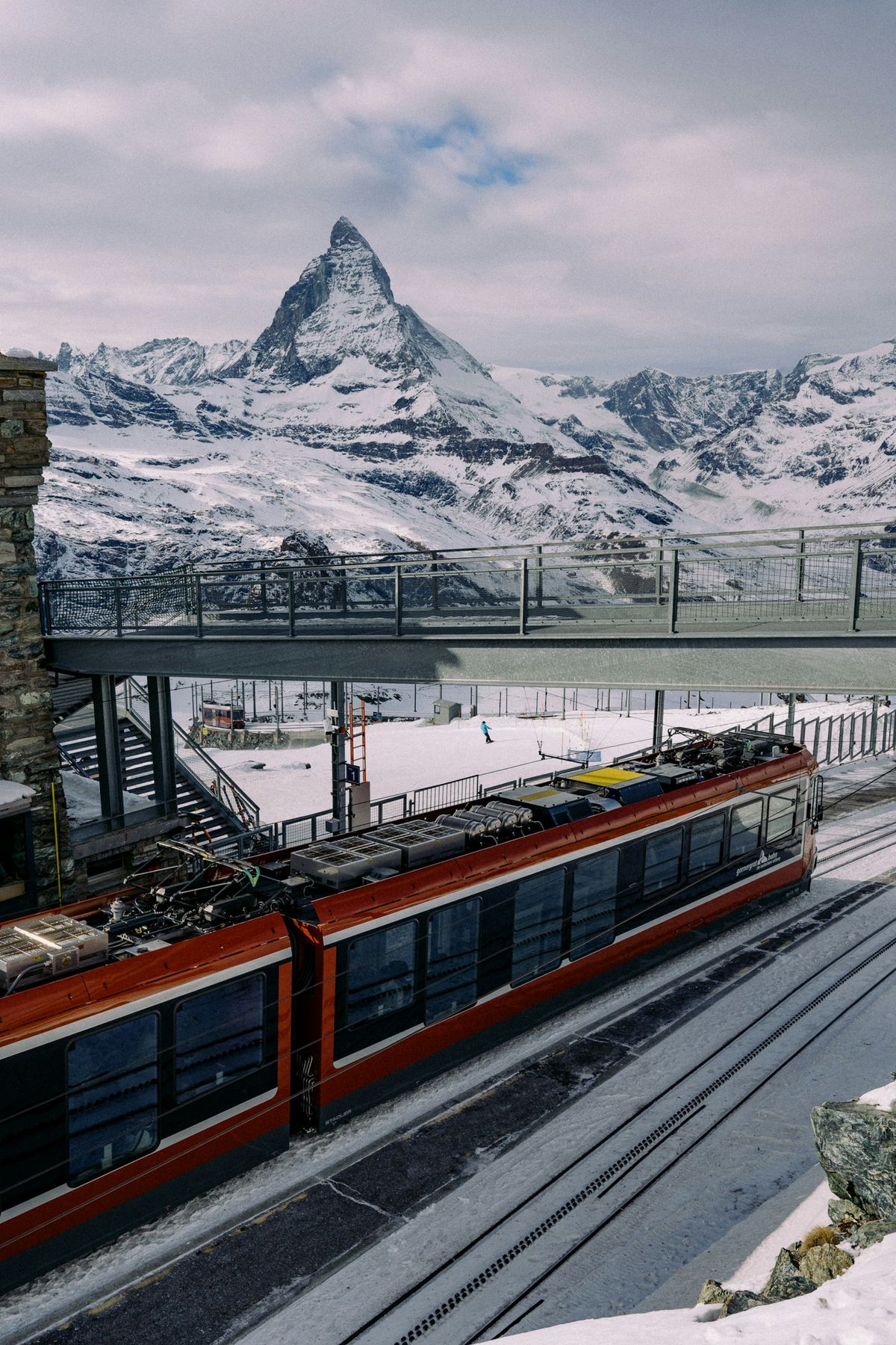 Red train with the Matterhorn mountain in the background
